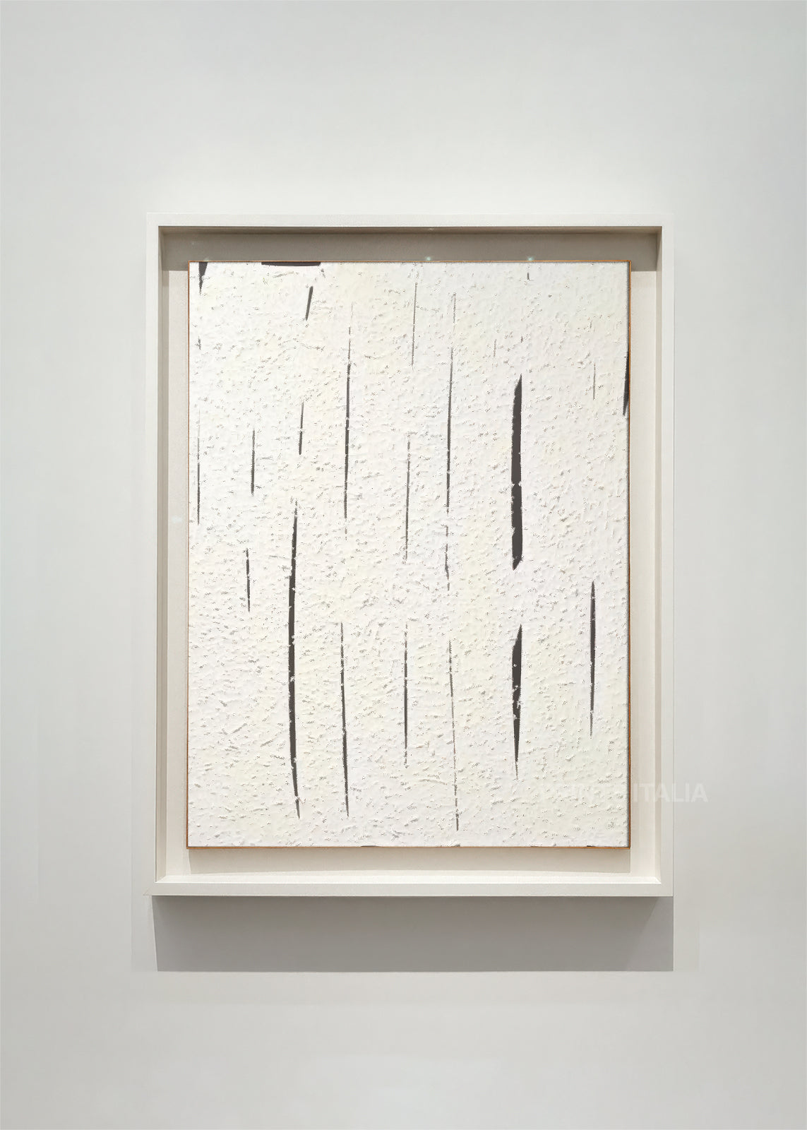ATHERA – framed minimalist abstract art print with luminous white surface and vertical incisions, displayed in a bright modern gallery