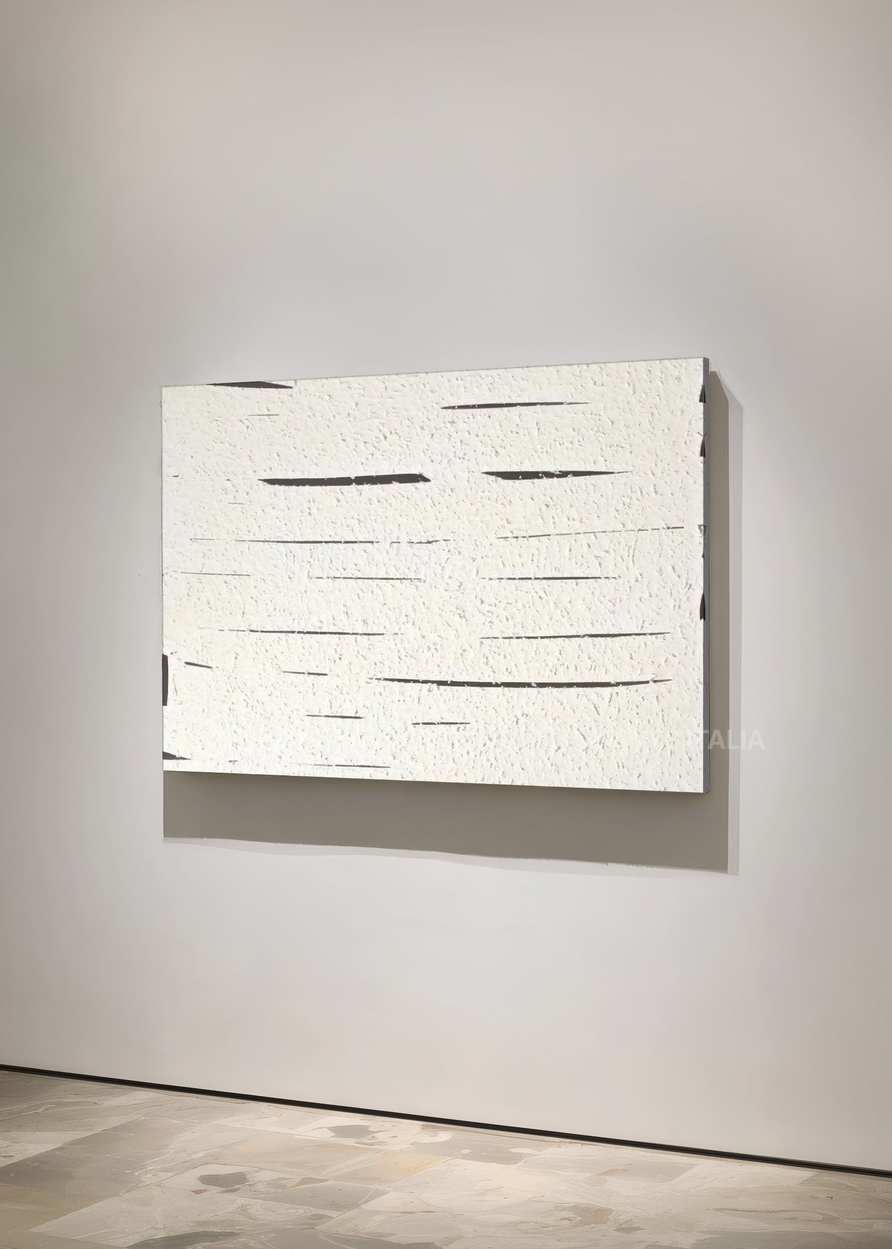 ATHERA print showing layered white texture and sharp vertical cuts, highlighting tactile detail and shadow play