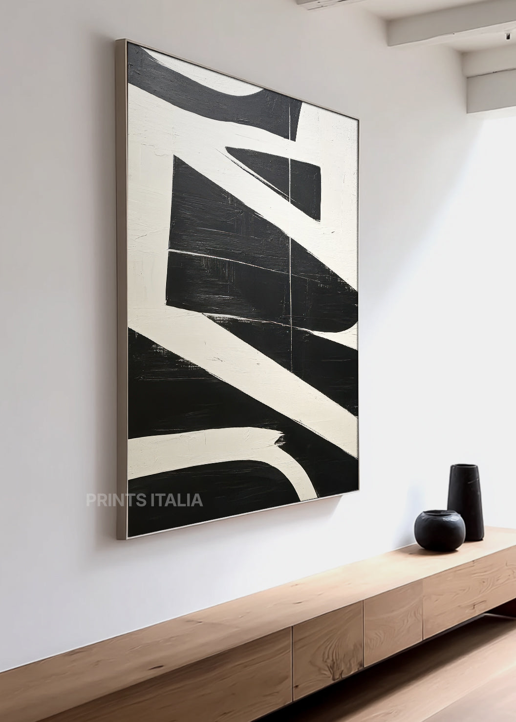 AUNIRA abstract print styled in a minimalist space, emphasizing its bold contrast and graphic depth
