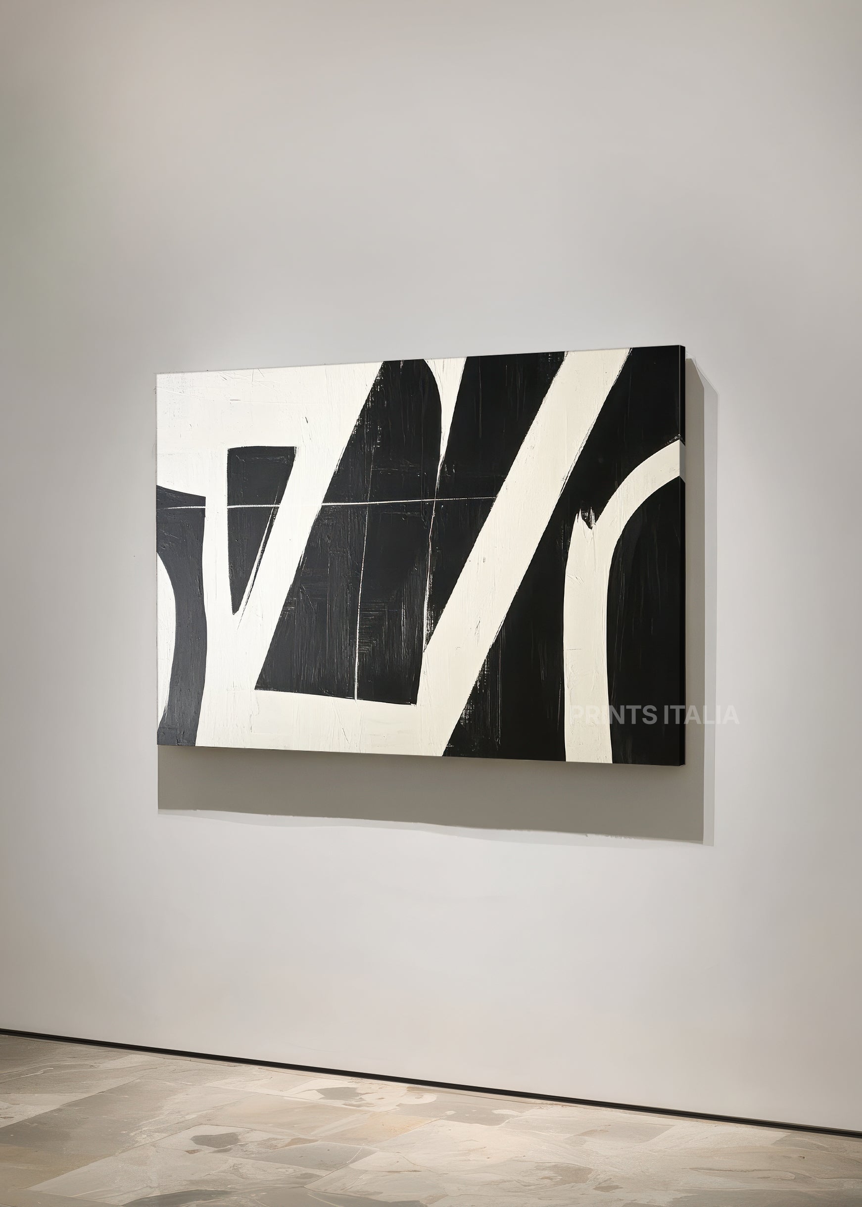 AUNIRA print displayed in a contemporary gallery, highlighting its sharp black shapes and dynamic composition