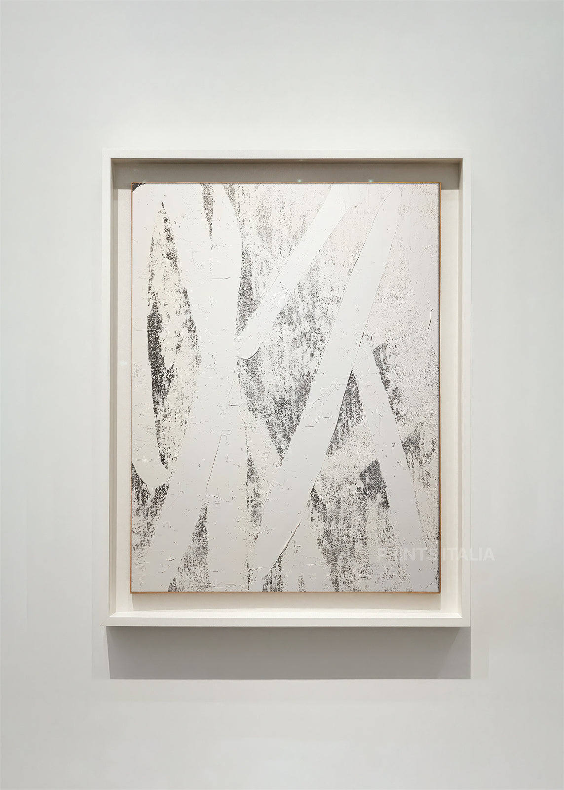 CALIVOR – framed minimalist abstract art print with bold slate arcs and textured white field, displayed in a modern gallery alcove