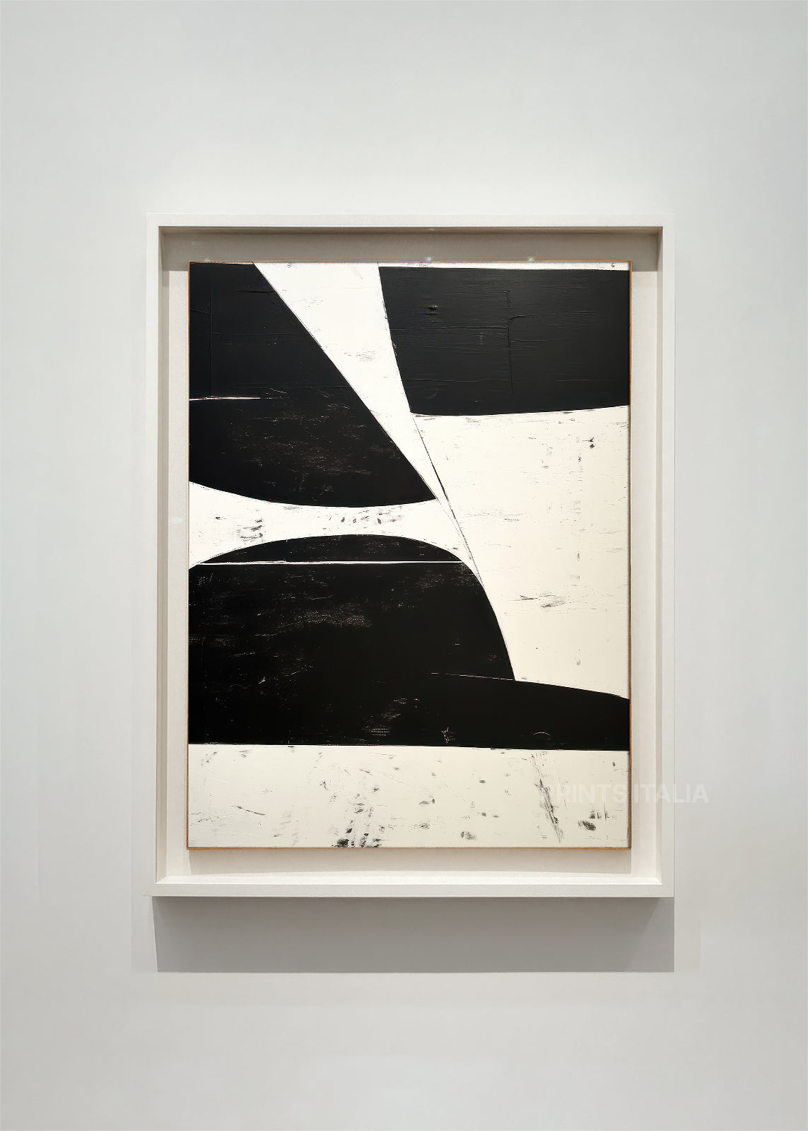 DRUELITH – framed minimalist abstract art print with bold black and white geometric forms, crisp contrasts, and distressed texture, displayed in a modern gallery