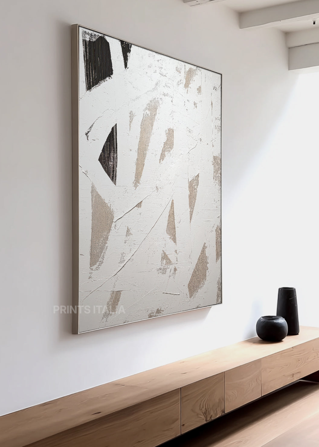 ERISEN abstract print in a bright interior, emphasizing its raw black strokes and serene white palette