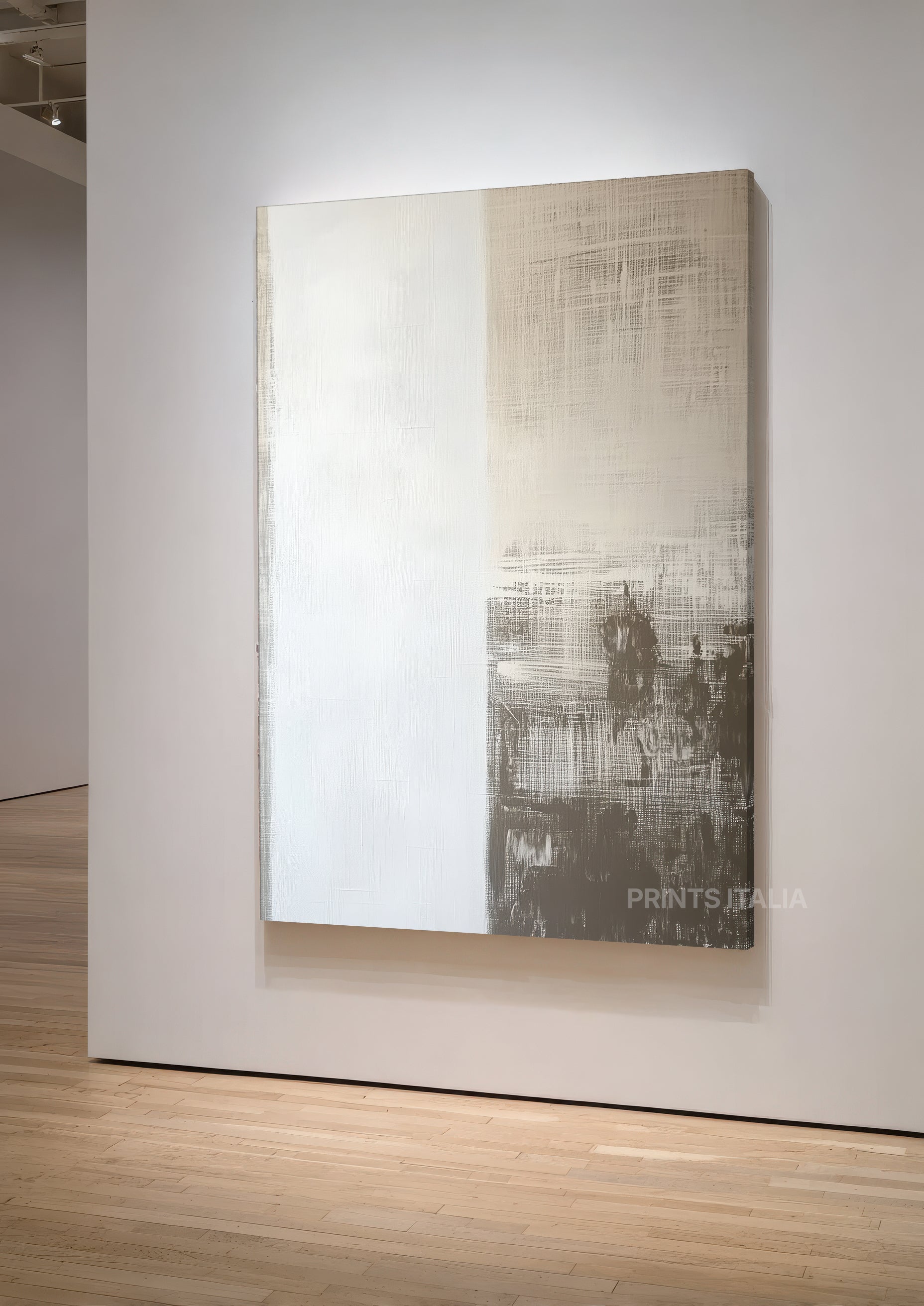 Isha abstract print featuring layered crosshatch textures and monochromatic gradations from cream to charcoal, displayed in white frame on gallery wall