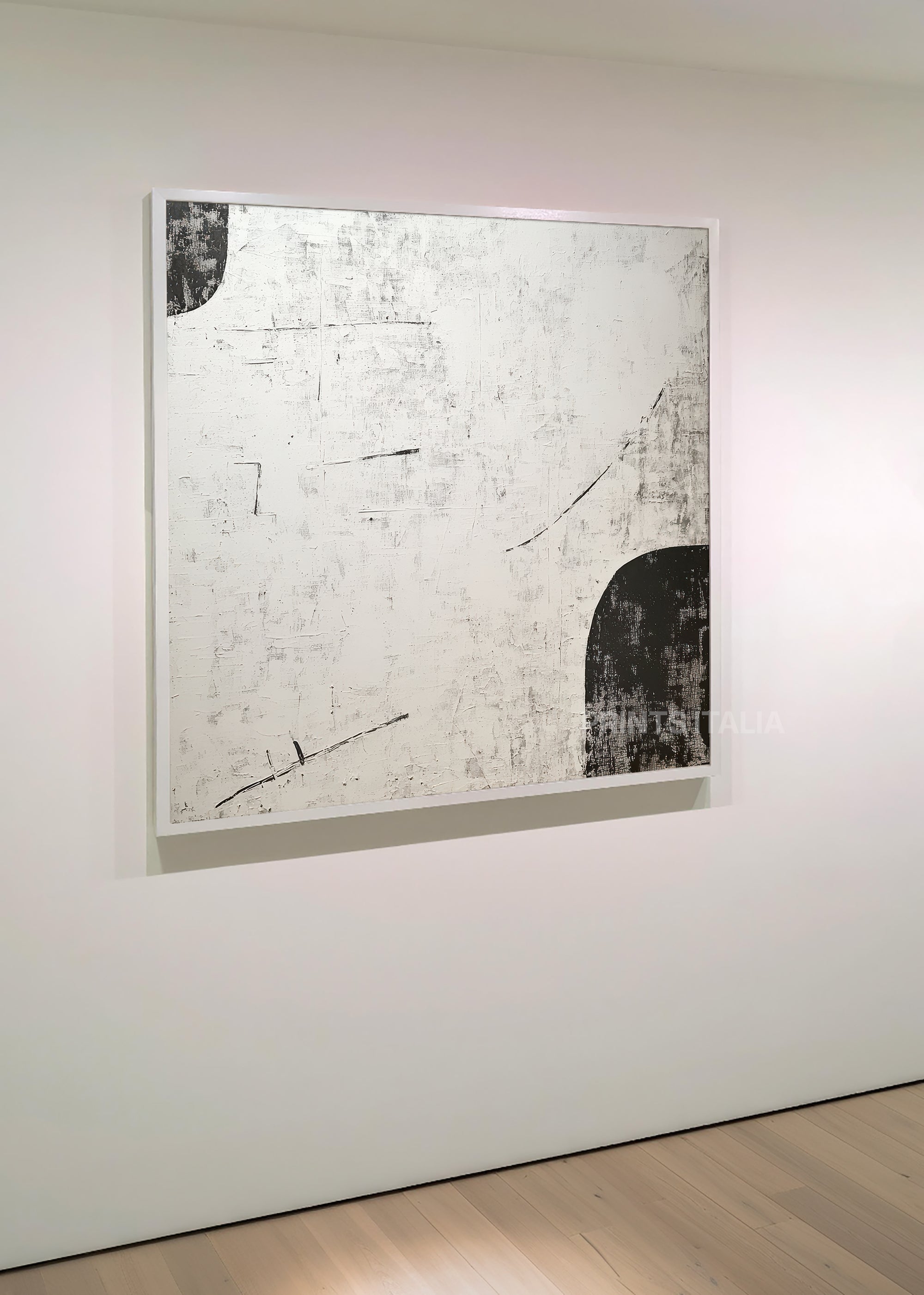 LUNERA print displayed in a minimalist gallery, highlighting its graphic black shapes and textured white surface