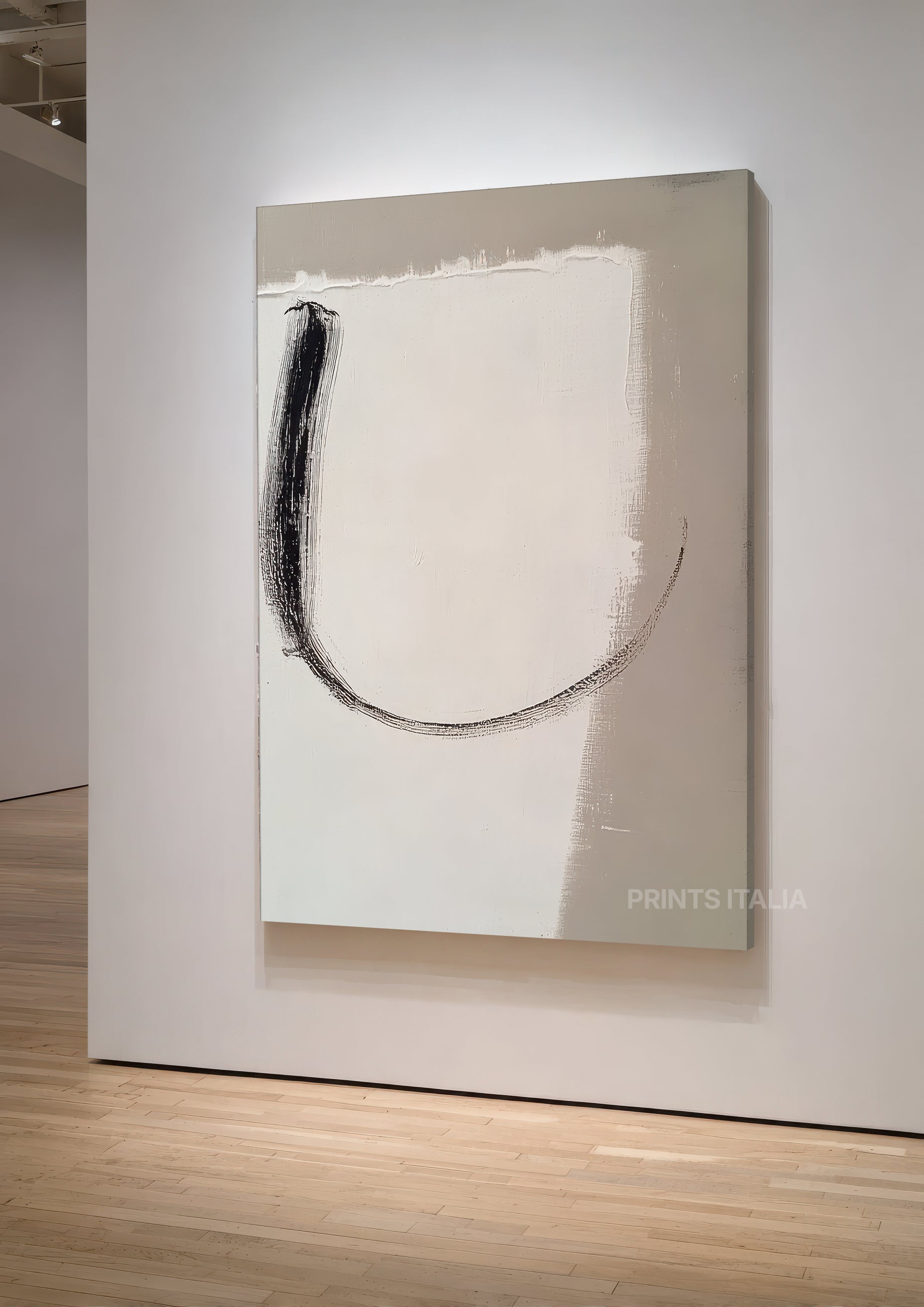Angled view of NAURO abstract print – minimalist taupe and ivory field with dynamic charcoal curve