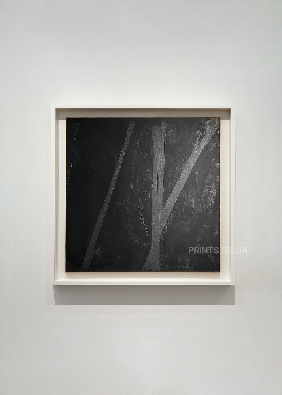 RIMA – framed minimalist abstract art print with deep charcoal background and intersecting silver-gray lines, displayed in a modern gallery