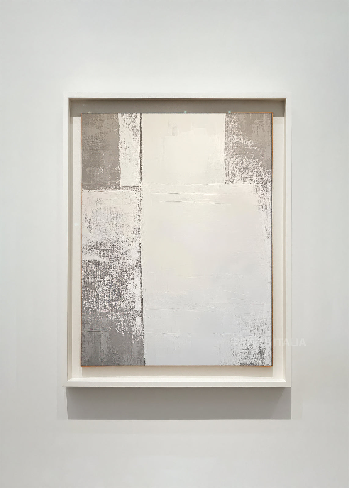 SOLITH – framed minimalist abstract art print with layered white and slate-gray blocks, gentle tonal shifts, and soft texture, displayed in a modern gallery