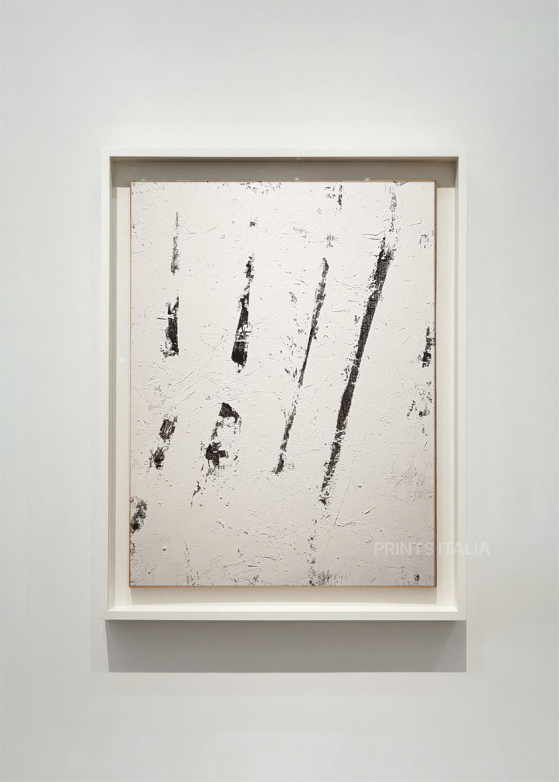 framed minimalist abstract art print with bold graphite lines on a textured white background, displayed in a modern gallery setting