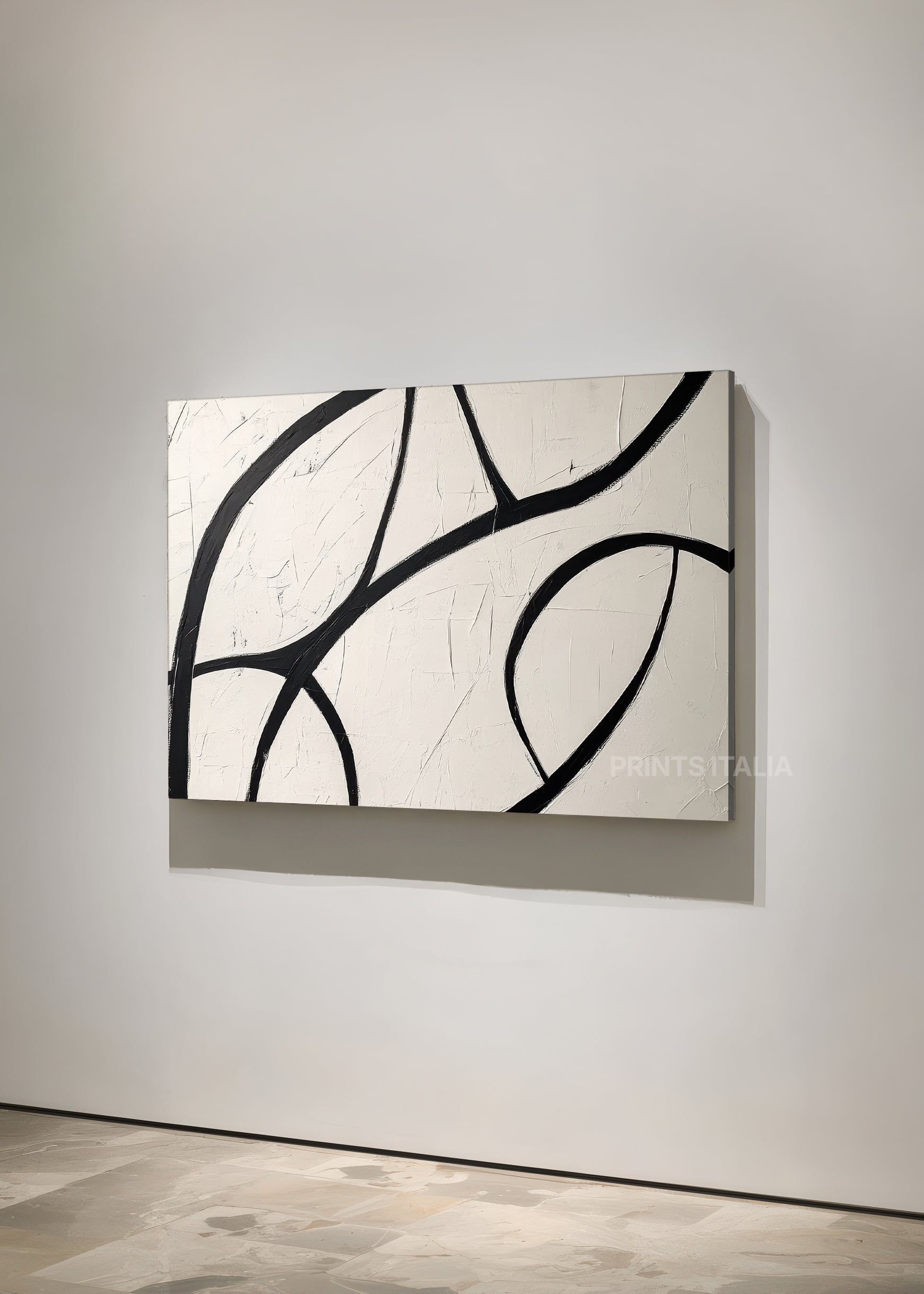 Angled view of TANU abstract print – modern expressive composition with bold black curves on neutral background