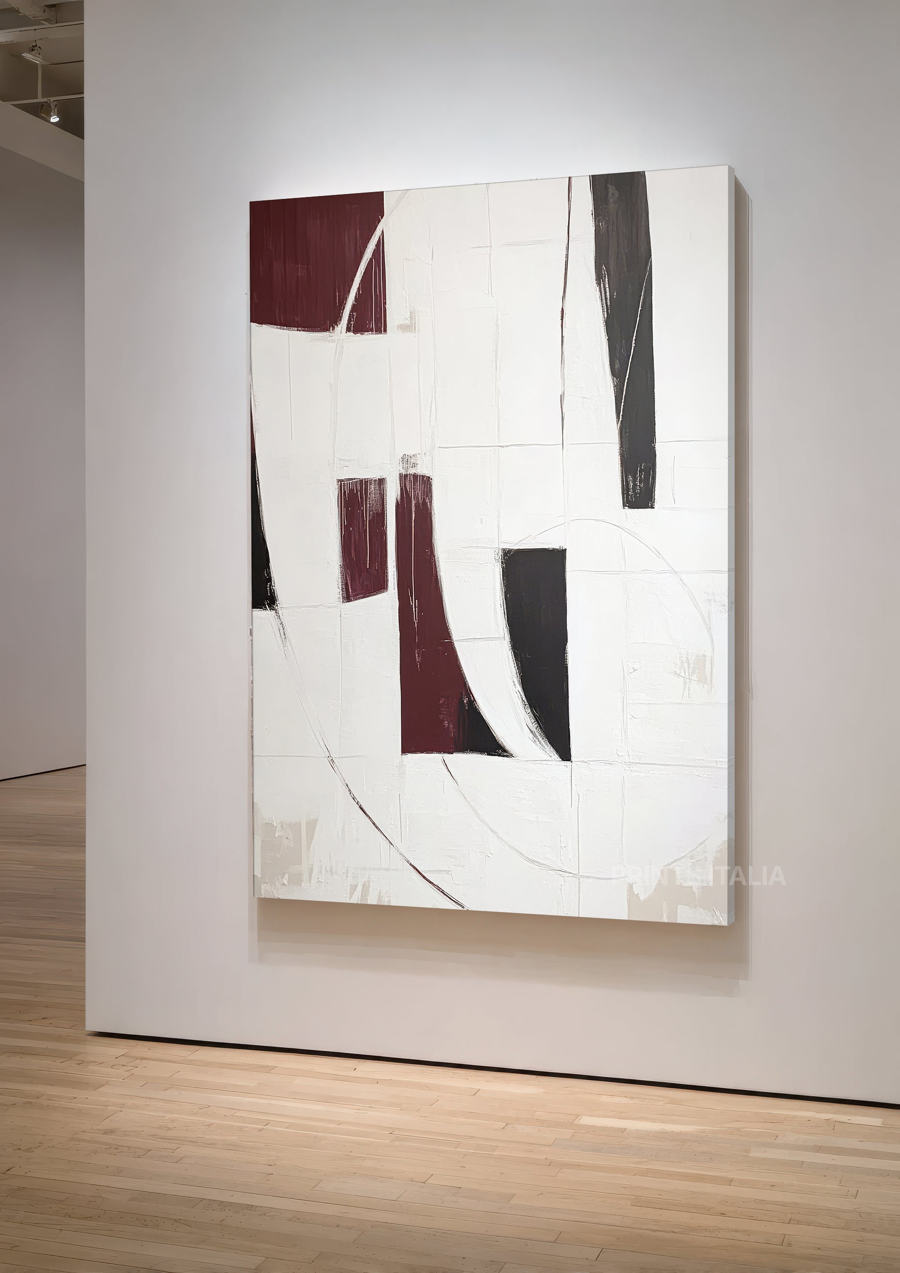 YAVARI abstract print styled above a modern sofa, showing bold burgundy and black forms in a contemporary interior
