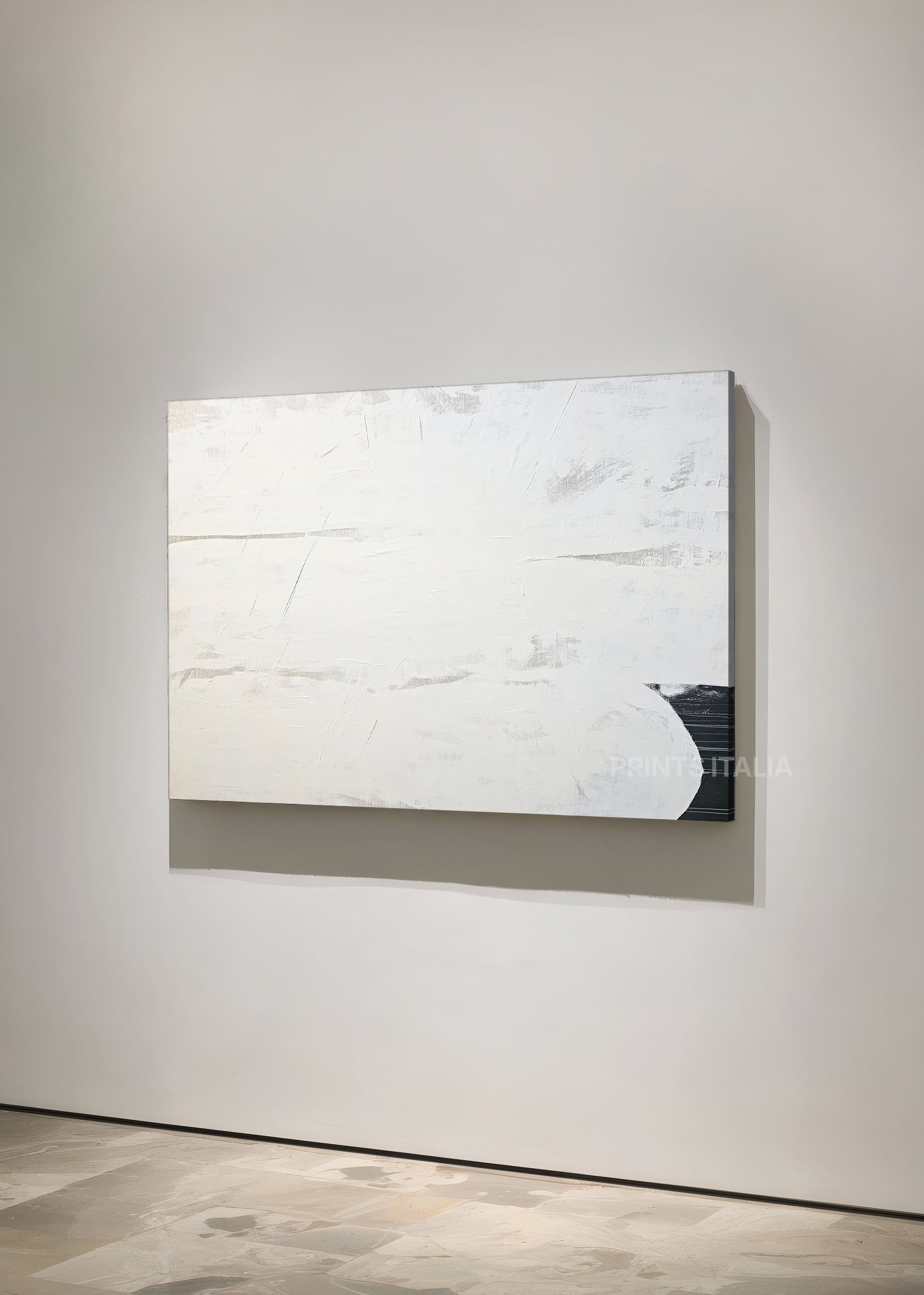 ZUNI art print featuring minimalist white composition, gentle textural variations, and a striking black shape, leaning against a soft gray wall
